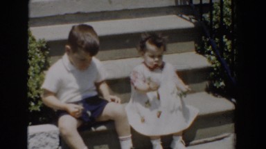 1960: Little Boy and Girl Sitting on Steps Playing, Bel Air Maryland