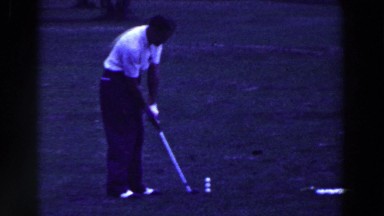1961: Golfer Attempts to Hit Three Golf Balls at Once with Iron in Ridgefield