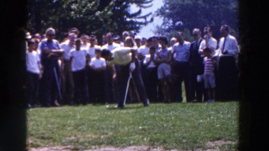 1961: Observers Gather Around an African American Man Teeing Off in Golf