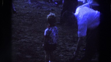 1961: Adults and Children Playing in the Sand by the Lake