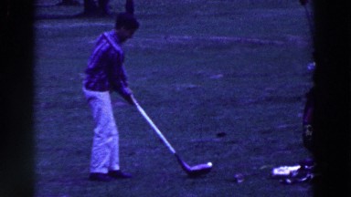 1961: Man Carefully Swinging Oversized Golf Club, Nearly Falls Over Ridgefield