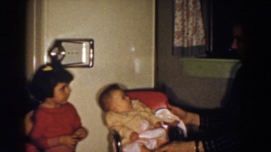 1958: Father Positioning Child in Chair, Aliquippa, Pennsylvania