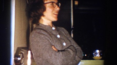 1958: Woman Takes Off Glasses While Talking and Gesturing at Party