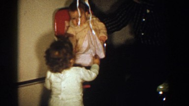 1958: Children Playing with a Baby and a Balloon in Aliquippa, Pennsylvania