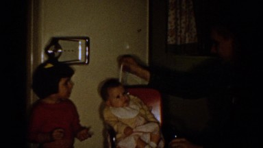 1958: A Father Grooming a Baby While His Other Kids Look On Aliquippa