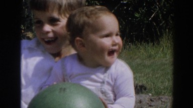 1964: Brother Playing Ball with Baby in Grass North Hollywood