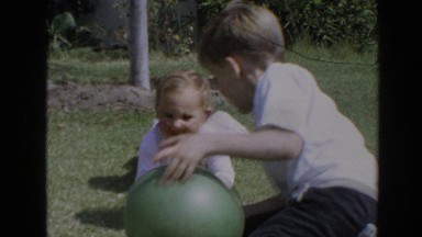 1964: Children Playing with a Ball in the Grass, North Hollywood, California