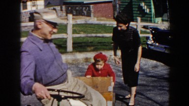 1964: Little Child Enjoying a Ride Outside in Pequot Lakes, Minnesota