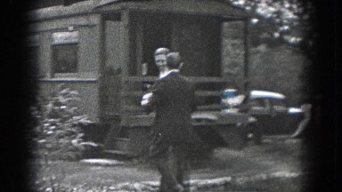 1938: Two Men in Suits Walking Toward Train in Reading, Pennsylvania