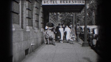 1938: A group of nurses walking outside a building and down the side in Reading