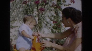1962: A Mom Playing and Helping Her Young Son Take His First Steps in Glendale