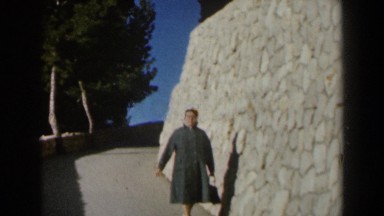 1960: Woman Walking by Large Stonewall in Israel