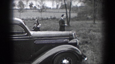 1938: A Family Gathering Outside Next to an Old Car in Reading, Pennsylvania