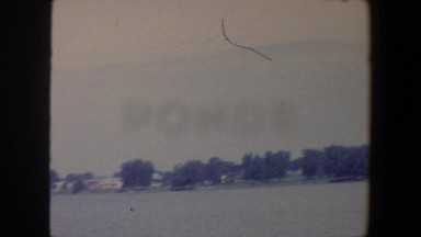 1959: People Standing in Front of a Large Lake in Iowa