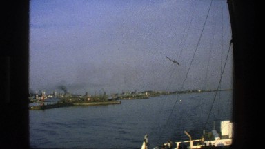 1975: Birds Fly in Circles Above Water Near Ship in Denmark