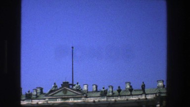 1975: A view of the top of a building with interesting architectural details.
