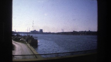 1975: view of town surrounded by water and green vegetation STOCKHOLM