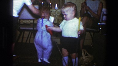 1973: Small Children Playing with Miniature Golf Sticks in Saint Paul Minnesota