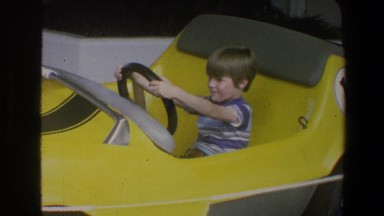 1973: Small Child Pretending to Drive at Walt Disney World Florida