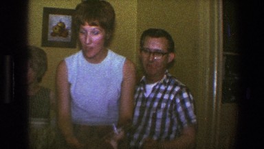 1973: A Young Boy Holding a Banjo at a Family Gathering in Saint Paul Minnesota