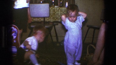 1973: cute little kids standing in the room around each other enjoying company