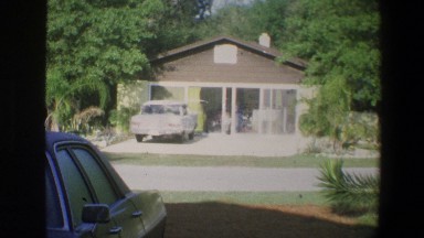 1973: View of People Piddling Around Inside a House; View from Across the Street