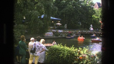 1975: a crowd of boat riders rowing on a pond on a sunday afternoon. COPENHAGEN
