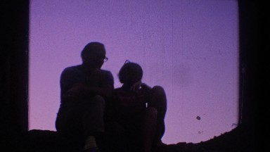 1969: friends observing from afar someone playing guitar and singing UTAH