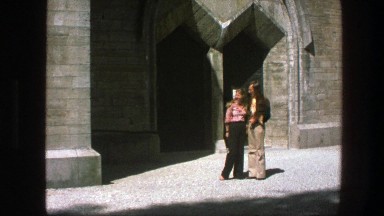 1975: a couple standing outside kissing in the daytime COPENHAGEN