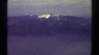 1969: scene of a mountain far away with lots of snow on its peak. LOS ANGELES