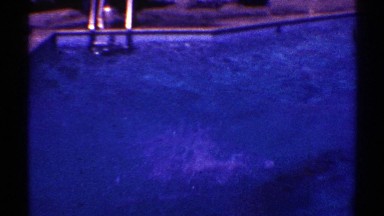 1969: a young boy dives off the diving board into the pool. NEVADA