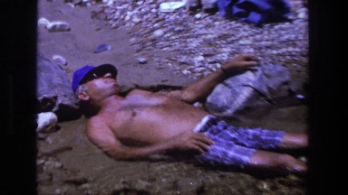 1969: man asleep laying in water. UTAH