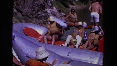 1969: a group of adventurers crowd into a large, inflatable raft UTAH