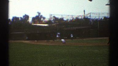 1969: community softball team practicing in a field. WOODLAND HILLS CALIFORNIA