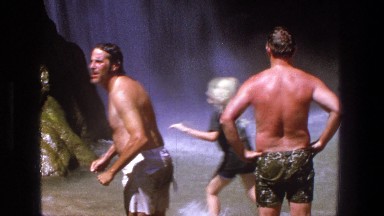 1969: family and friends having a great time in a body of water splashing around