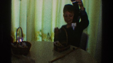 1969: two boys sitting at table and taking out something from the basket
