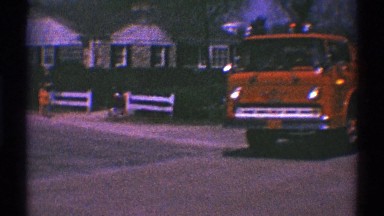 1969: a bright red fire engine in a hometown parade