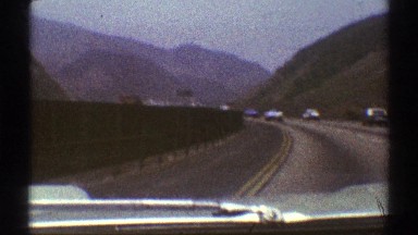 1969: cruising down a curved highway in the mountains LOS ANGELES CALIFORNIA