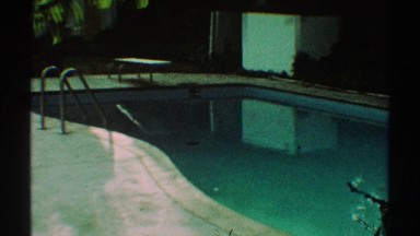 1969: panning camera view of creepy old pool. LOS ANGELES CALIFORNIA