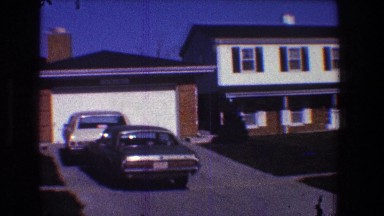 1968: view of a strip of homes alongside the sidewalk. TOLEDO OHIO