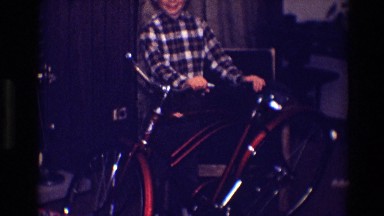 1968: ten year old boy grins wildly at his spiffy new birthday present. TOLEDO