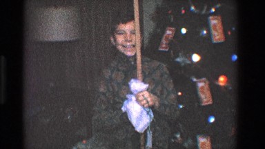 1968: a child is celebrating a special annual event with a family