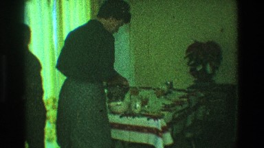 1968: a woman sets the table for supper while her young sons look on TOLEDO OHIO