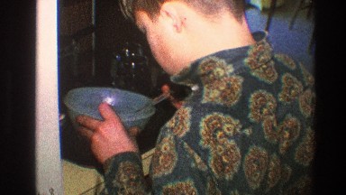 1968: man pouring food into bowl TOLEDO OHIO