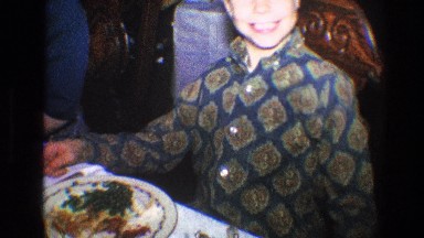 1968: a young boy is hamming for the camera and points to his teeth