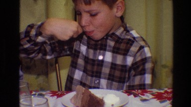 1968: a boy eating cake on top of a white plate with a spoon TOLEDO OHIO