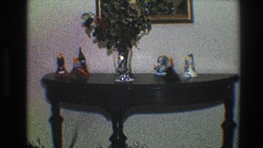1968: on the wooden black table dolls, flower vase etc are kept TOLEDO OHIO