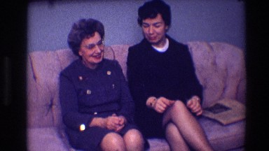 1968: people sitting on the couch having a great conversation and enjoying