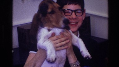 1968: a happy young man holding his dog-friends for life TOLEDO OHIO