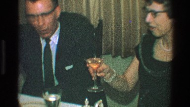 1968: a man and his wife, wine toasts and kisses each other TOLEDO OHIO